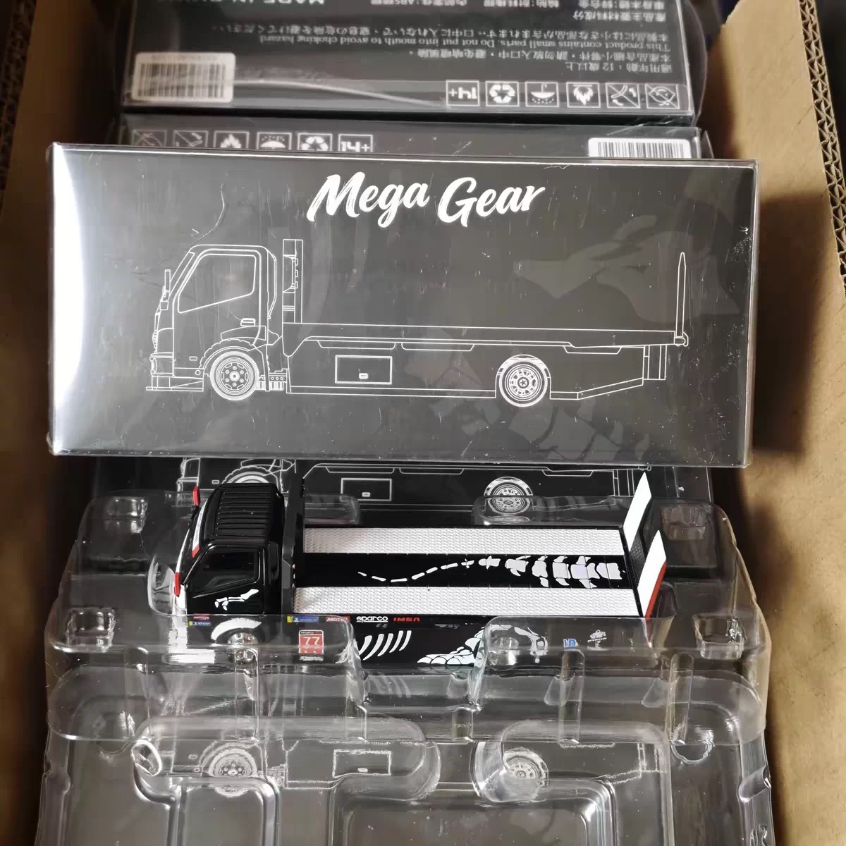 Mega Gear 1:64 Scale Diecast Flatbed Truck Model with Black and White Livery